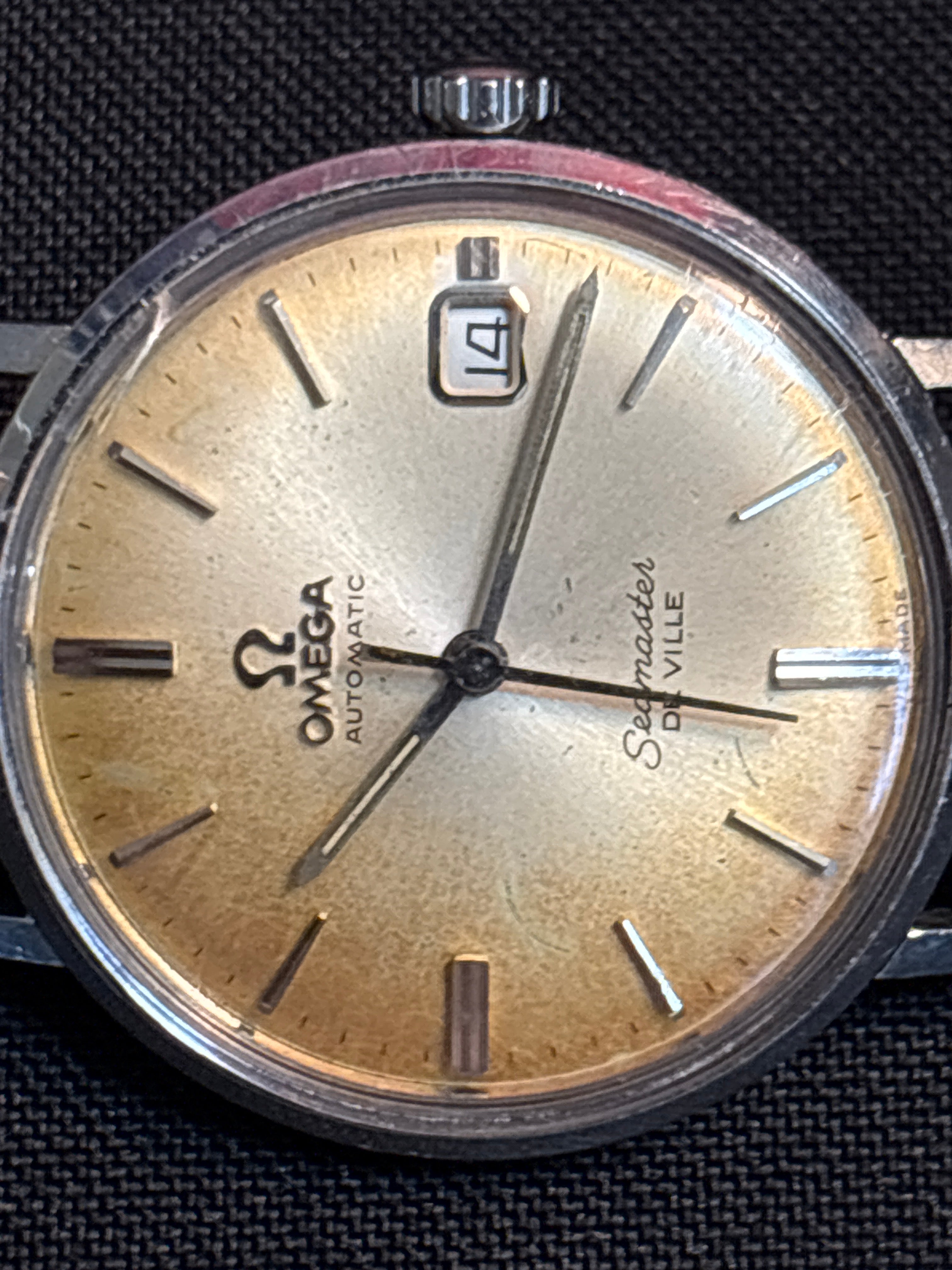 Omega Seamaster Deville date SS case on beads of rice bracelet.