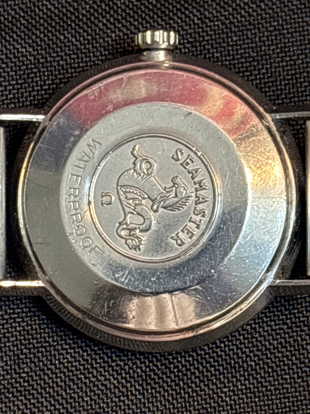 Omega Seamaster Deville date SS case on beads of rice bracelet.