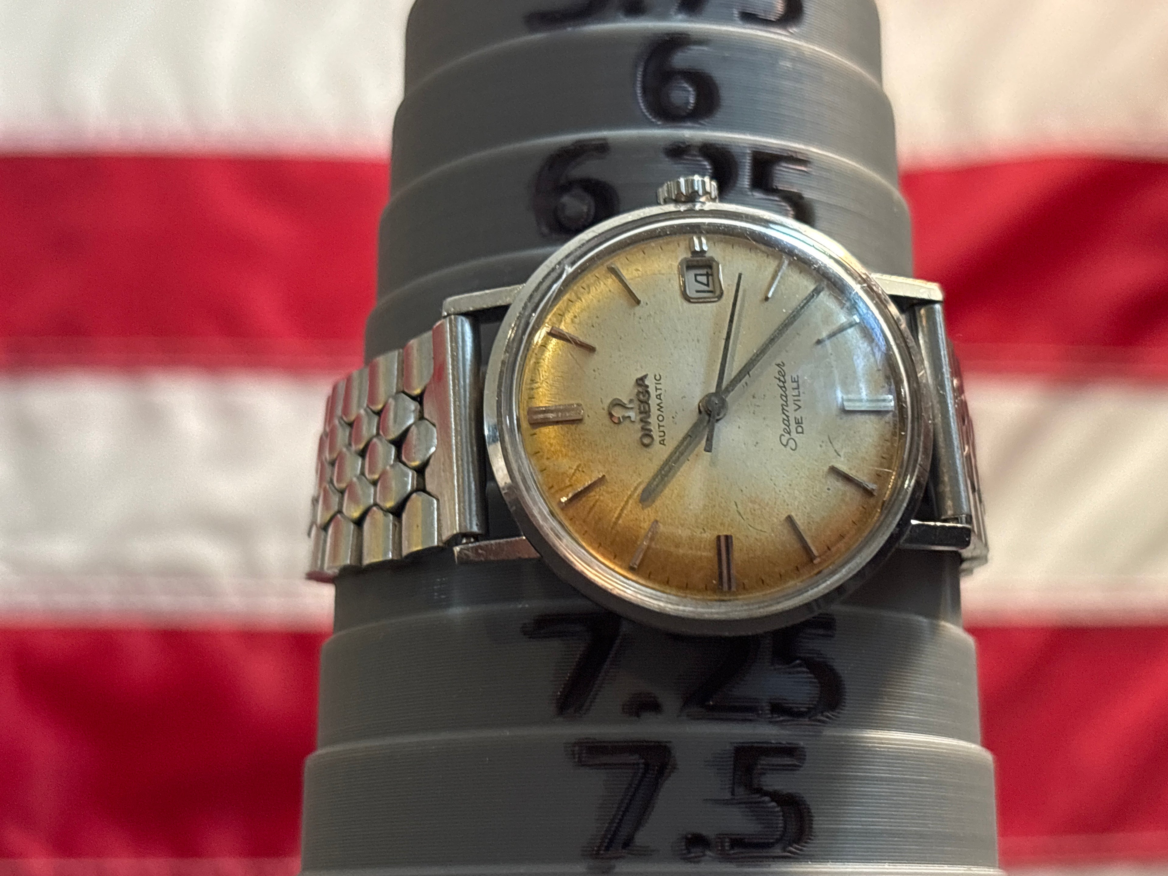 Omega Seamaster Deville date SS case on beads of rice bracelet.