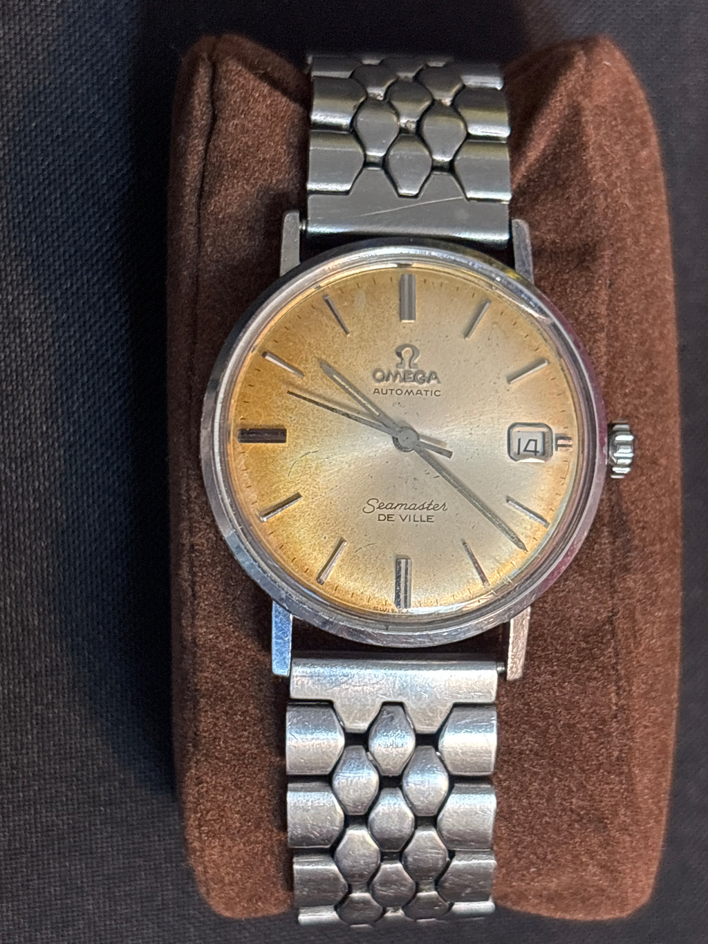 Omega Seamaster Deville date SS case on beads of rice bracelet.