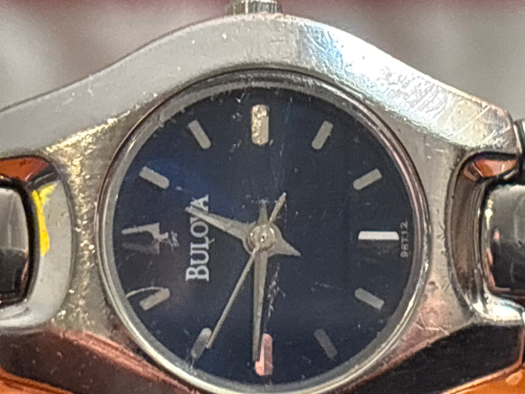Bulova ladies quartz time piece on stainless steel bracelet