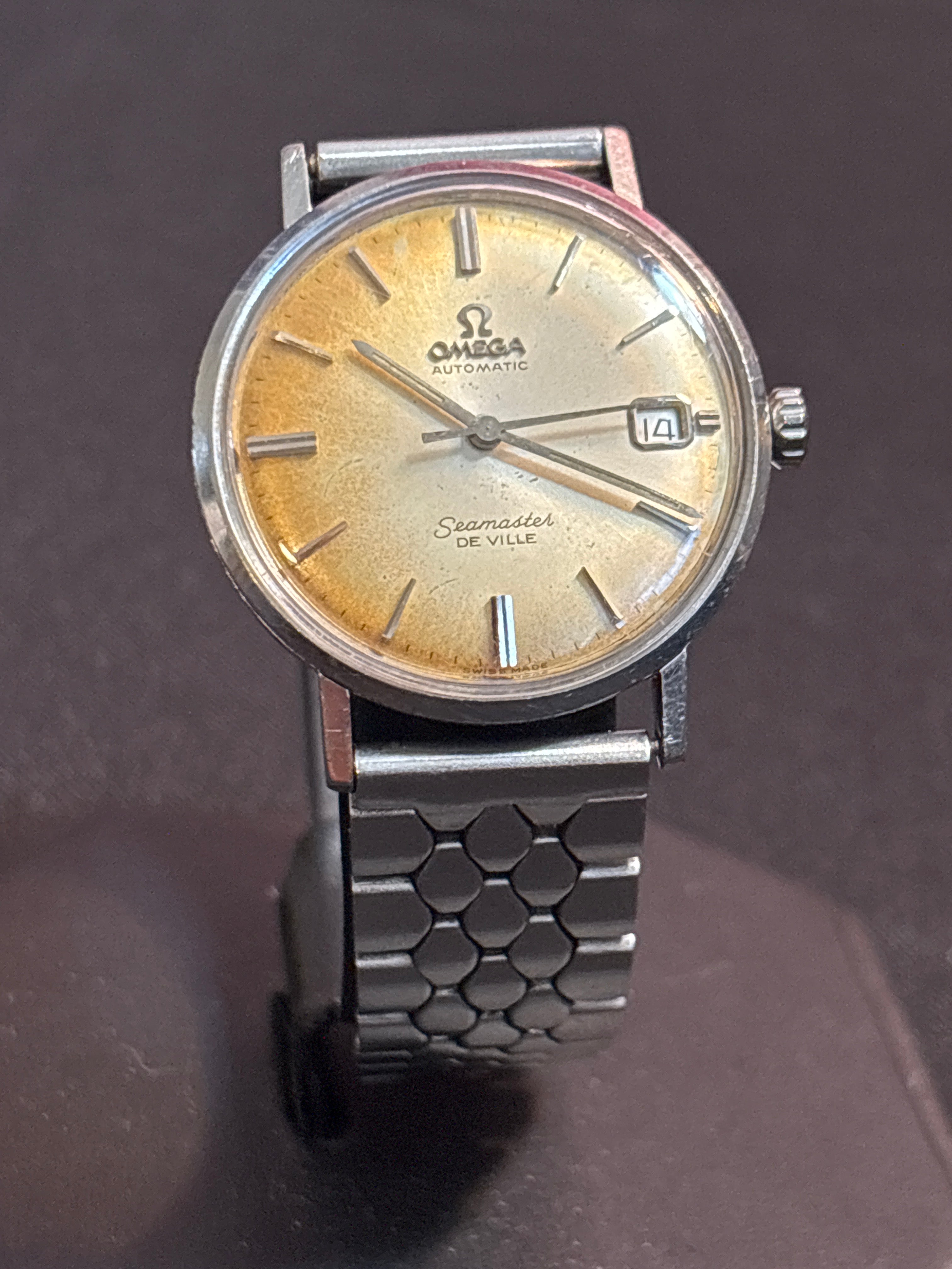 Omega Seamaster Deville date SS case on beads of rice bracelet.