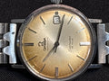 Omega Seamaster Deville date SS case on beads of rice bracelet.
